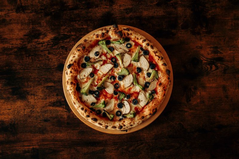 BBQ Chicken marcos pizza with caramelized onions